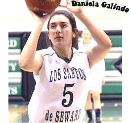 Image of women's basketball player Daniela Galindo shooting a foul shot in her white LOS SANTOS de SEWARD number 5 uniform.