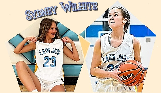 Images of Tennessean girls basketball player, Sydney Wilhite, Cumberland County High School shownin white LADY JETS uniform number 23, siting with hands on shoulders looking towards our right to her going up for a basket.