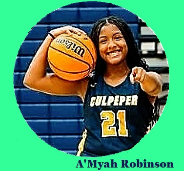 Virginian girl basketballer A'Myah Robinson, Culpeper County High School, #21 pointing with left finger at us, ball held up on her right shoulder.