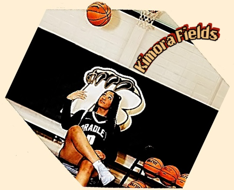 Kimora Fields, Bradley Central High, Tennessee, girls basketball player, sitting on a chair in uniform, right leg over left flipping bal up near the basket.