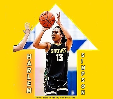 Pictured shooting a right handed shot at the basket is Harlem Simpson, a basketball star on the Groves High School team in Michigan. Number 13.