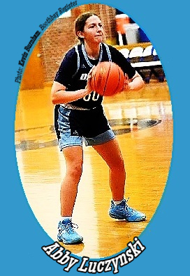 Image of Abby Luczynski, basketball player on the Dirigo High School girls team in the state of Maine, shown passing the ball in her #00 uniform. Photo by Kevin Burnham, Boothbay Register, Jan. 28, 2026.