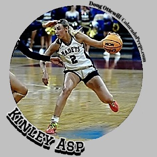 Kinley Asp, looking o make a play for the Air Academy High School girls basketball eam at Colorado Springs, Colorado. Shown looking to make a play in her white number two KADETS uniform.