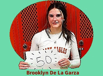 Brooklyn De La Garza, female basketball player, following  her January 30th 2026 50 point game, holds up a '50' sign.