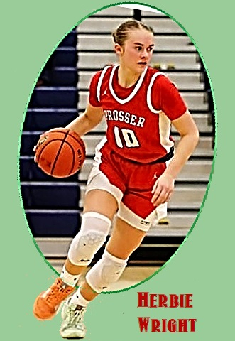 Herbie Wright, girl basketball player in the State of Washington for the Prosser High Mustangs, shown making a play in her red  #10 PROSSER uniform.