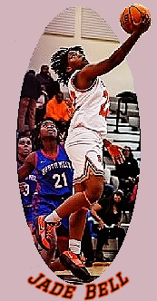 Jade Bell, Rocky River High (North Carolina) girls basketball player, shown putting a ball up into the basket with his right hand.