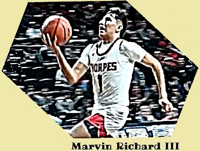 Marvin Richard III, in his THORPE #1 uniform, speeding in for a right-hand one-arm shot at the basket for the Pine Ridge High School Thorpes basketball team in South Dakota.