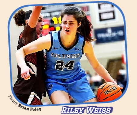Riley Weiss, Columbia University basketball player, #24 in blue, driving around a defender.