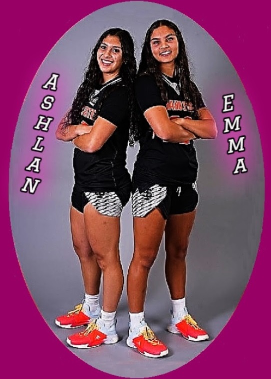 Photo of the Bryant Sisters of the Deer Park High School in the State of Washington, in uniform standing back to back, arms crossed. Ashlan Bryant on the lefy, Emma Bryant on the right.