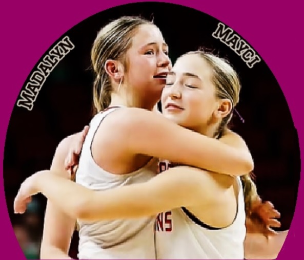 Still image of basketball playing sisters Madalyn and Mayci Dolliver hugging after their Pender High School team won their 4th straight Nebraska state championship, March 7, 2026, 63-48 over Elkhorn Valley. It was Madalyn's 4th. She is the taller one on the left.
