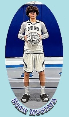 Noah Mustafa, Green School of Teaching, New York, basketball whiz, shown holding a white basketball with both hand in front of lower chest in his white BROADWAY jersey.