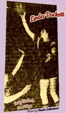 Linda Puckett, Clinton Arrowette high school basketball player, shooting a one-handed jump shot over Betty Tadlock of the Forest High Bearkittens in the Pearl Invitational Tournament championship game, won by the Clinton Arrowettes, 72-51. From The Clarion-Ledger, Jackson, Mississippi, January 10, 1961. Photo by Claude Sutherland.