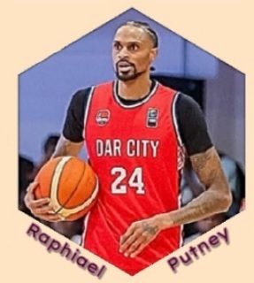 Image of Raphiael Putney, basketball player  dir Dar City club in Tanzania in red #24 uniform, holding ball in right arm.