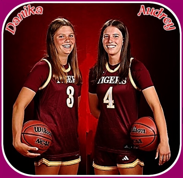 The Shindelar sisters, Danika (#3), on the left, & Audrey (#4), on the right, in maroon and white TIGERS uniforms..