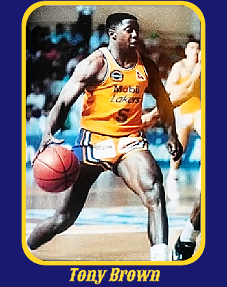 Tony Brown, Hutt Valley Lakers bringing the ball to the basket in a yellow uniform reading Mobil Lakers.
