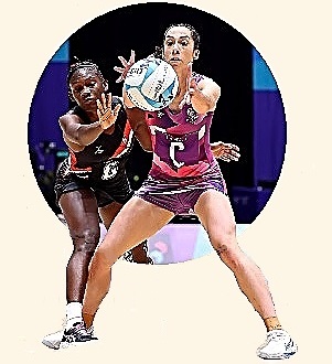 Two women playing Netball.