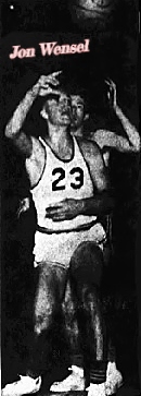 Image of basketball player, Jon Wensel, number 23, after taking a shot. We see the ball heading towards the basket. From The Eau Claire Leader, Eau Claire, Wisconsin, December 31, 1959.