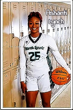Image of girls basketball player Ashanti Lynch, North Lenoir High School (North Carolina), #25, standing with basketball next to hall lockers.