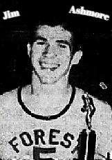 Mississippi boys basketball player, Jim Ashmore, Forest High Schhol, wearing uniform #5, holding a trophy. From the Scott County Times, Forest, Mississippi, January 22, 1953.
