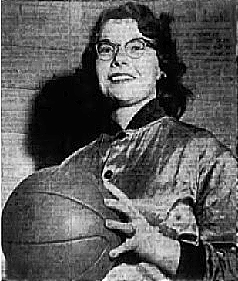 Anita Belanger, high school basketball player on the Mattawamkeag High team, shown in satin jersey, with basketball bespeckled. Staff photo by Webb, the Bangor Daily News, January 13, 1955.