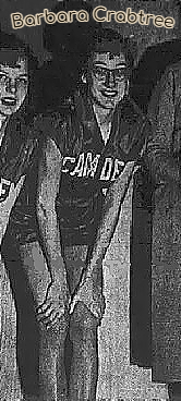 Image cropped from team image in The Bangor Daily News, Bangor, Maine, February 5, 1954. Crouched with hands on knees, eyeglasses, of Barbara Crabtree, Camden High School (Maine0. Photo by Maher. Mary Bennett is partially viewed on the left side of image.