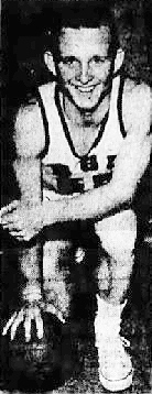Photo of boys basketball player Jimmy Darrow, Bowling Green High School, Ohio, kneeling on right knee, right arm on ball on ground, left arm resting on left knee. From the Fremont News-Messenger, Fremont, Ohio, March 4, 1960.