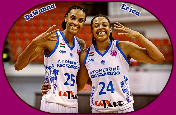 Image of sister Erica McCall and DeWanna Bonner, playing for KSC Szekszard in Hungary in FIBA EuroCup, 2021. Standing next to each other in white uniforms with blue lettering, DeWanna is #25, Erica #24.