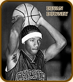 Picture of Devan Downey, boys basketball player for Chester High School in South Carolina. Holding ball, with both hands, above his head. From The Charlotte Observer, Charlotte, North Carolina, December 15, 2004. Photo by Diedra Laird.