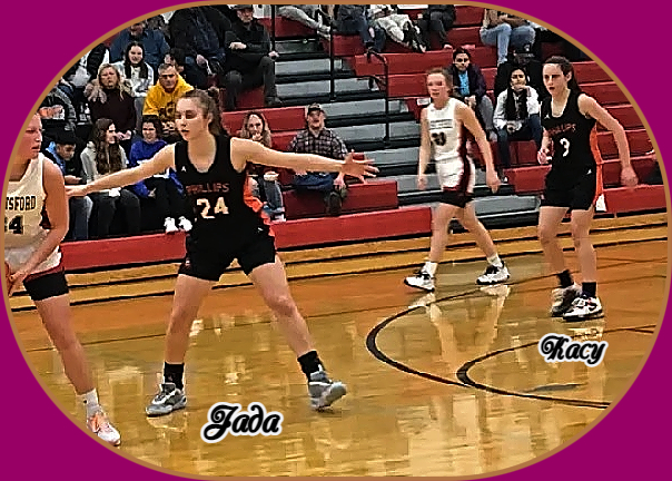 Image of the Eggebrecht sisters playing basketball for Phillips High School team in Wisconsin. On defense with arms spread is older sisterr, Jada, #24. In the background, Kacy, #3.