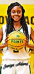 Janiya Adams, Bessemer City girls basketball player (North Carolina) holding up her 50 point ball after the game.