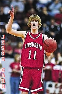 Photo of Jesse Carr, boys basketball player, #11, in red uniform off Ainsworth High School, Nebraska. From the Norfolk Daily News, March 9, 2007. Jeremy Buss, correspondent.