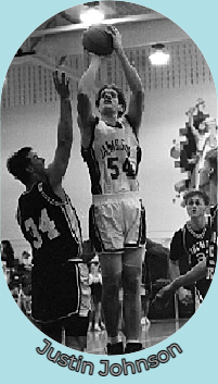 Post-Journal file photo of Justin Johnson, Jamestown High School (N.Y.), #54, up in the air shooting a jump shot.