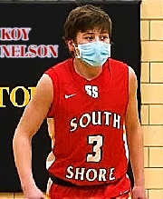Image of Wisconsin boys basketball player, Koy Nelson, South Shore High Cardinal in red #3 SOUTH SHORE uniform, wearing mask during a game.