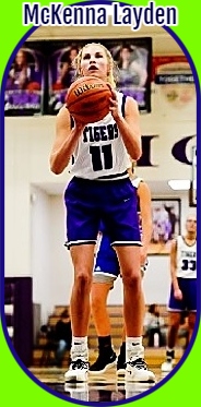 Image of McKenna Layden, Northwestern High School, in Indiana, shooting a foul shot in her #11 blue on white TIGERS jersey with blue shorts.