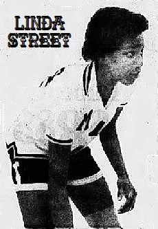 Action image of girls basketball player Linda Street, Mitchell High School, Tennessee, dribling ball to our right. From The Jackson Sun, Jackson, Tenn., March 9, 1976.