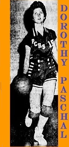 Image of Dorothy Paschal, Putnam County High School girls basketball player, in Georgia, shown in PCHS unifor mumber 15, dribbling ball. From tThe Macon Telegraph and News, Macon, Georgia, February 25, 1959.