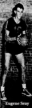 Image of Eugene Seay, basketball player, shown in North Greenville Junior College uniform #16, posing with basketball, from The Greenville News, Greenville, South Carolina, January 14, 1954.