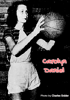 Damascus High School (Georgia) girls basketball player Carolyn Daniel, shown preparing to shoot a foul,, or set, shot to our right, wearing horiontal striped shirt behind white jumper uniform. From The Macon News, Macon, Georgia, March 2, 1948. Photograph by Charles Snider.