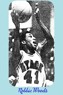Image of Robbie Woods in his white #41 Nyack HS uniform shooting up at basket to our right. FPhoto by Warren Inglese, in the Sunday Journal-News, Rockland County, New York, December 28, 1975.