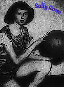 Photo of girls basketball player, Sally Rowe, Rangely High School (Maine), holding basketball on left knee, looking at camera from the side. Image by Portland Press Herald staff photographer Maguire, Portland, Maine, March 24, 1953.