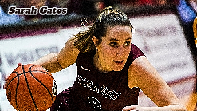 Image of McMaster College (Ontario) women's basketball player driving upcourt.