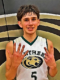 Image of boys basketball player Gianni Altman, Gold Beach High School in Oreon, shown in uniform #5 after scoring 52 points ina  December 2022 game.