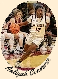 Number 12, Aaliyah Converse, girls basketball player for St. George's High School, Tennessee, in her white GRYPHONS uniform.