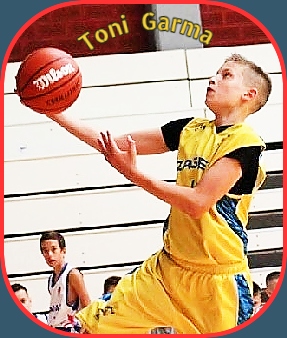 Image of 12-year old Croatian basketball player, in yellow Novi Zagreb uniform, going up for a lay-up.