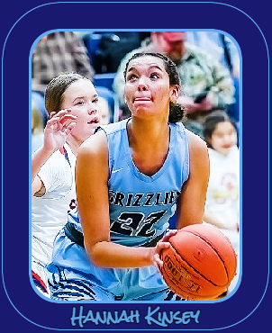 Number 22, in light blue uniform number 22, in dark blue lettering, GRIZZLIES, about to shoot the basketball for the North Woods High School team in Minnesota, Hannah Kinsey. Photo by D. Colburn, The Timberjay, January 25, 2023.