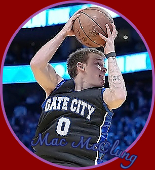 Image of Gate City High School (Virginia) basketball player going up for a dunk, in his dark blue (with lighter blue strip on the side) GATE CITY uniform, number zero.