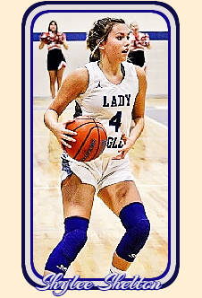 Tennesseean girls basketball player, Cosby High School, shown with ball about to make a play in white LADY EAGLES  #4 uniform.