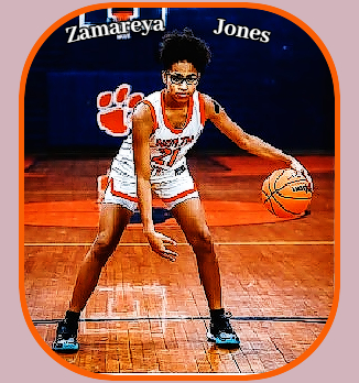 Image of North Carolinian girls basketball player Zamareya Jones, posing with ball, in position, number 21 in whit uniform with tan trim, North Pitt High School.