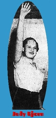 Photo of Maine girls basketballer Judy Bjorn, Falmouth High School, showing her defensive posture with right arm straight up in air. From the Portland Press Herald, Portland, Maine, March 12, 1955