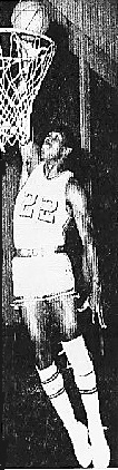 Image of Ollie Taylor, San Jacinto College basketball player, high above the basket about to dunk in uniform number 22. From the Tyler Courier-Times--Telegraph, Tyler, Texas. March 3, 1968..